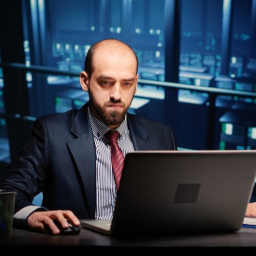 Male infrastructure engineer working in render farm